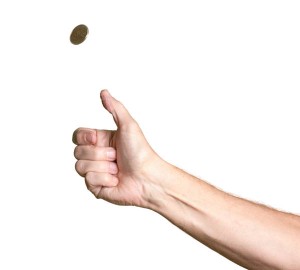 Cut out isolation of man arm flipping a coin