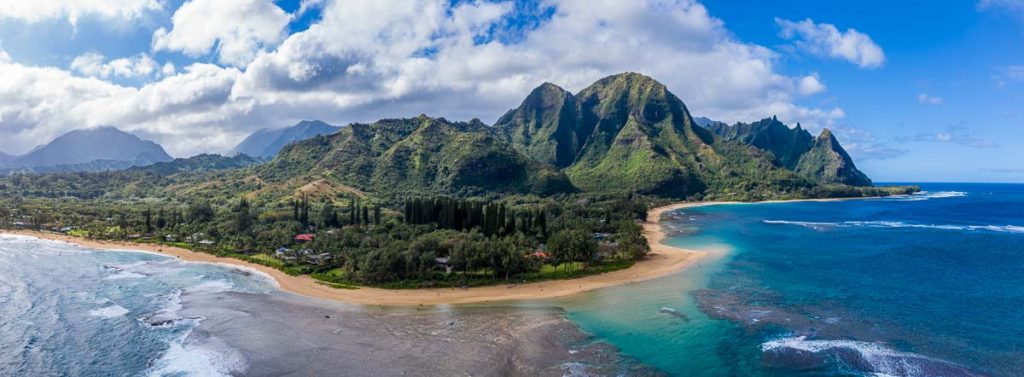 aerial panorama of Tunnels beach and the Na Pali mountains in Kauai, Hawaii
