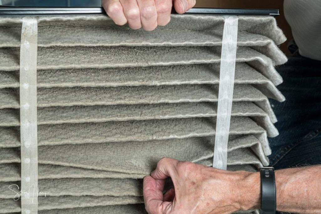 Stock photo of the dust in an air filter in home furnace installation