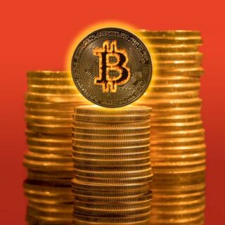 Stock photo of bitcoins in fire with rising prices