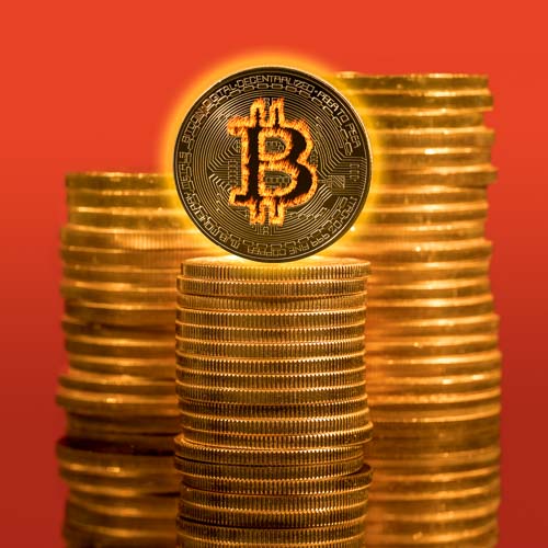Stock photo of bitcoins in fire with rising prices