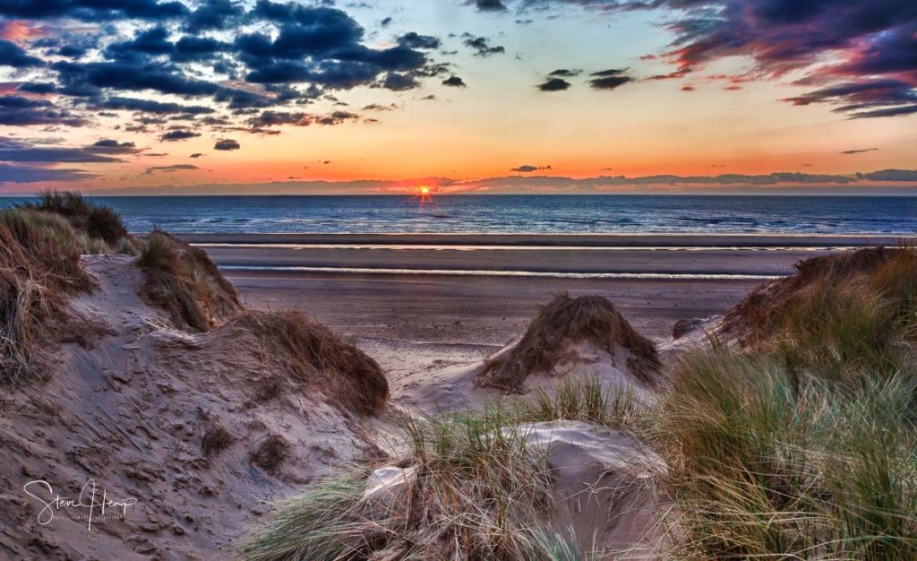 Fine art print of a sunset over the sand dunes on Formby Beach in north west England