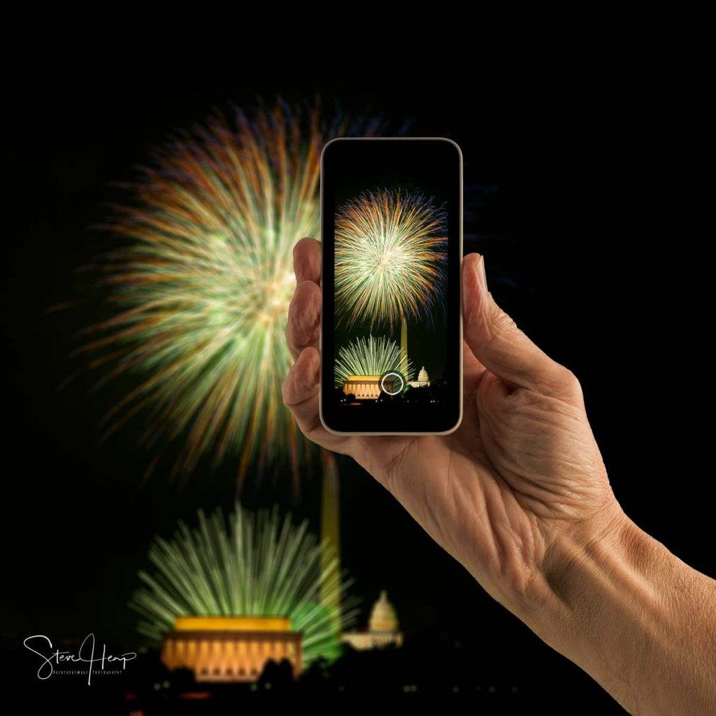 Stock photo of composite of fireworks in Washington DC onto a smartphone screen