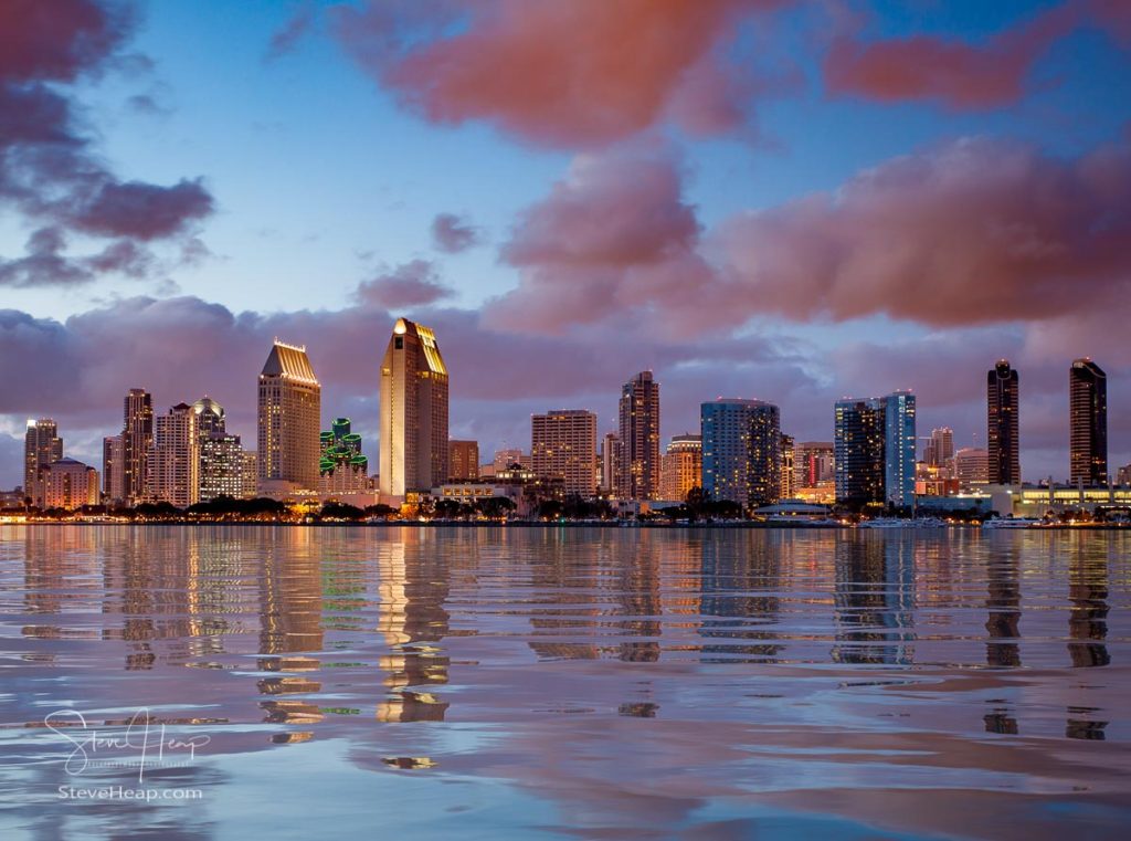 Skyline cityscape of San Diego downtown skyscrapers at night with lights reflecting into a digital ocean sold as 42 inch Acrylic print. See original print here