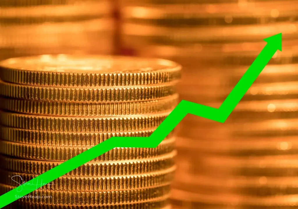 Forecast growth in price of gold with gold coins in the background